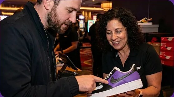 Guest choosing sneakers at an on-property shopping event